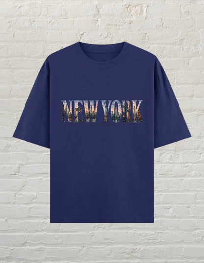 CoreTeez royal blue oversized cotton t-shirt featuring a New York cityscape graphic print on the front.