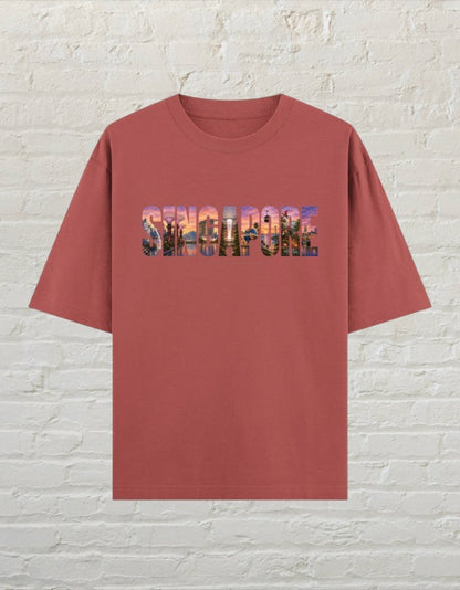 CoreTeez unisex oversized cotton t-shirt in coral featuring a Singapore cityscape graphic print