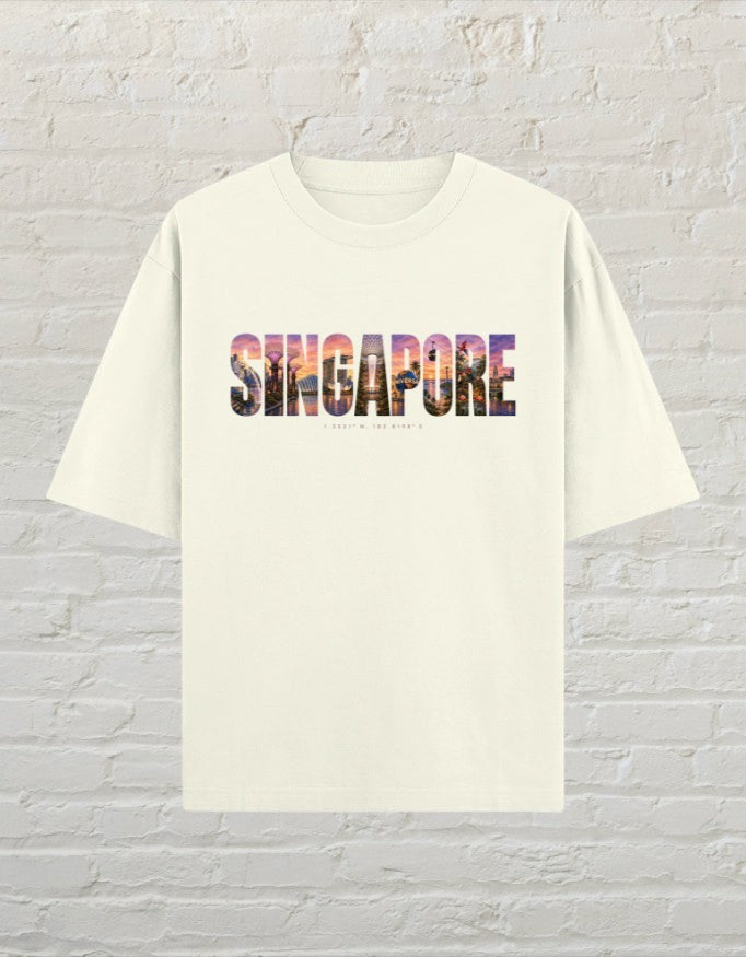 CoreTeez unisex oversized off white cotton t-shirt featuring a colourful Singapore cityscape graphic print