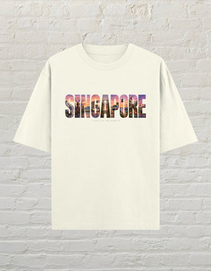 CoreTeez unisex oversized off white cotton t-shirt featuring a colourful Singapore cityscape graphic print