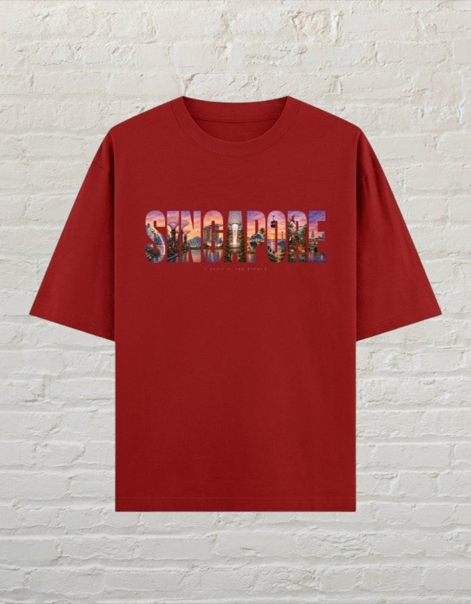 CoreTeez unisex oversized red cotton t-shirt featuring a colourful Singapore cityscape graphic print on the chest.
