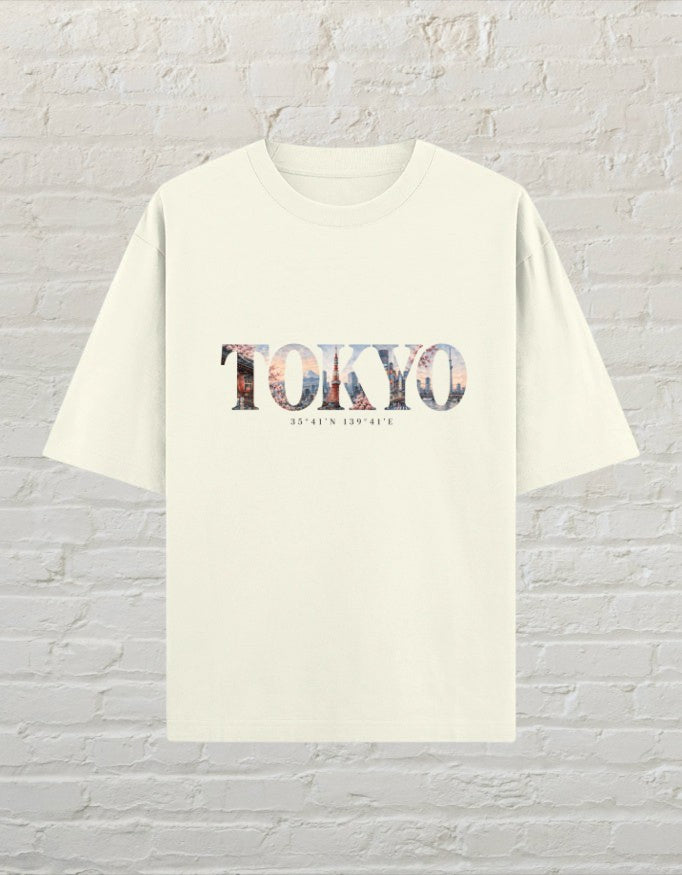 CoreTeez unisex oversized off white cotton t-shirt featuring a Tokyo city skyline graphic print on the front