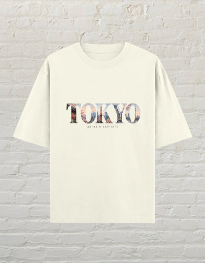 CoreTeez unisex oversized off white cotton t-shirt featuring a Tokyo city skyline graphic print on the front