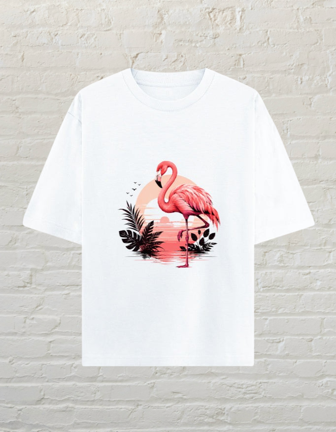 CoreTeez white oversized cotton t-shirt featuring a flamingo graphic with a tropical sunset background.