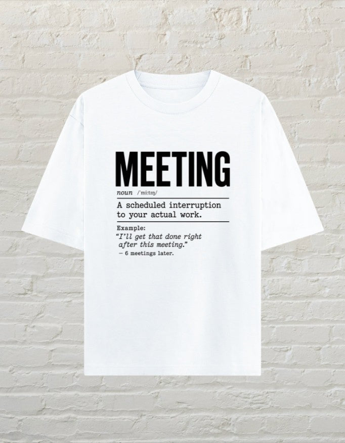 CoreTeez white oversized unisex cotton t-shirt featuring a black dictionary-style graphic about office meetings.