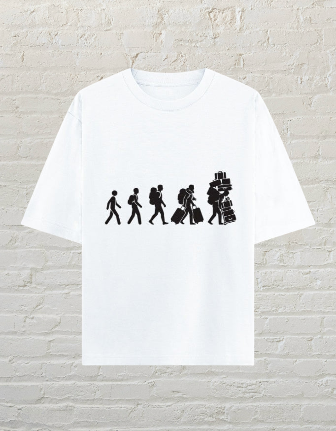 CoreTeez white oversized cotton t-shirt featuring a graphic of a traveler carrying increasing amounts of luggage.