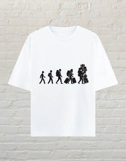 CoreTeez white oversized cotton t-shirt featuring a graphic of a traveler carrying increasing amounts of luggage.