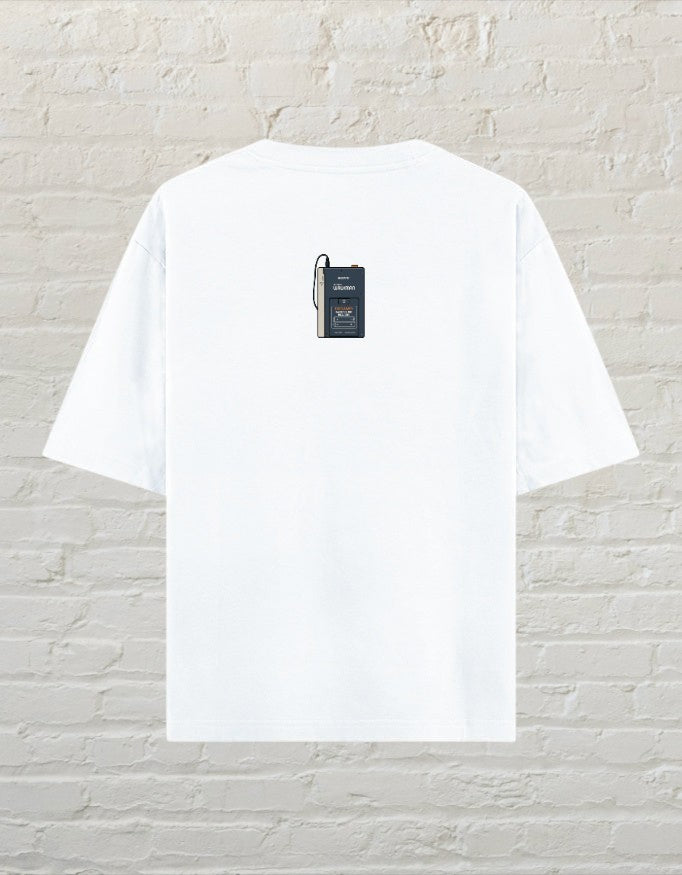 CoreTeez white oversized unisex cotton t-shirt featuring a small retro cassette player graphic on the back